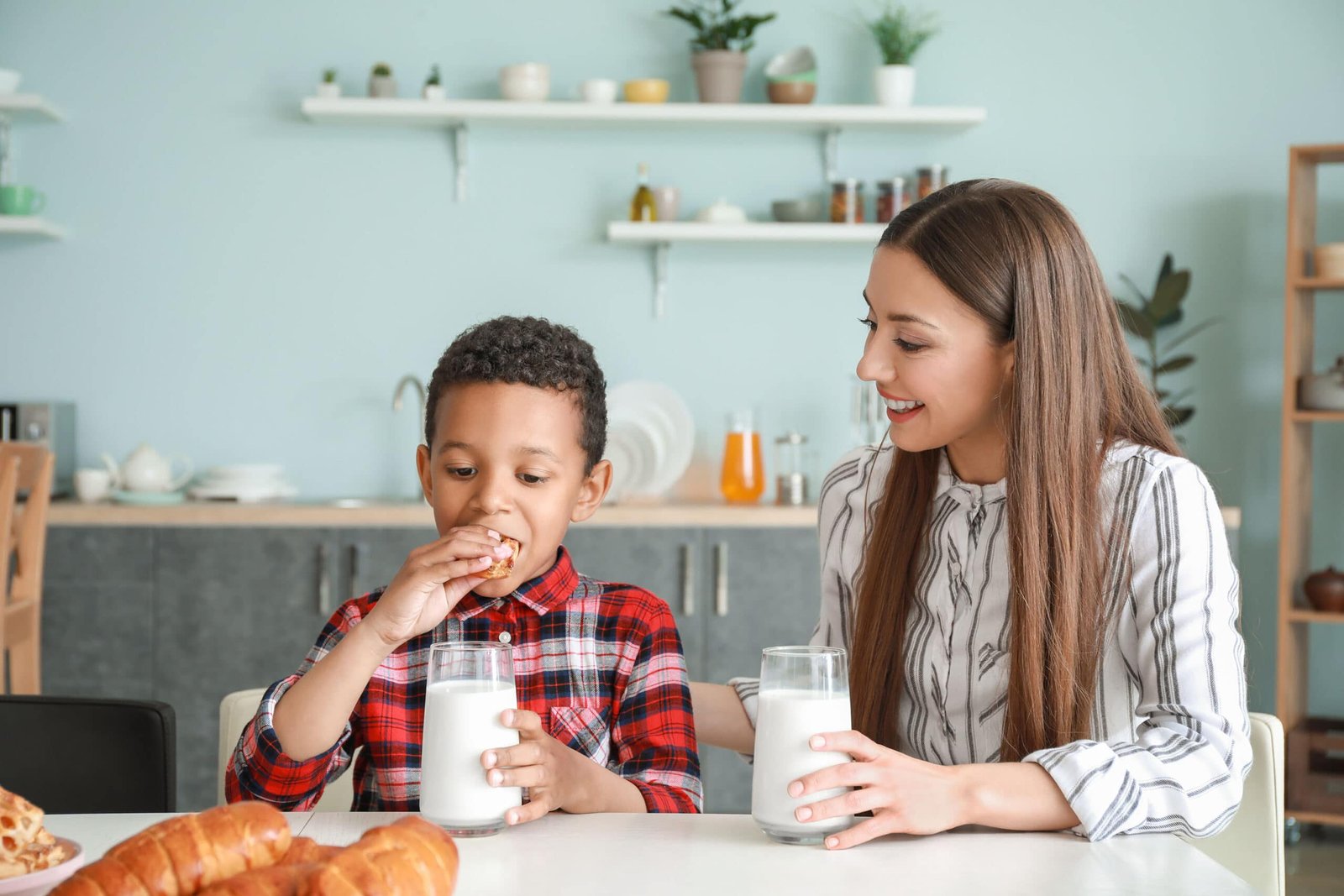 children drinking milk happy family kitchen