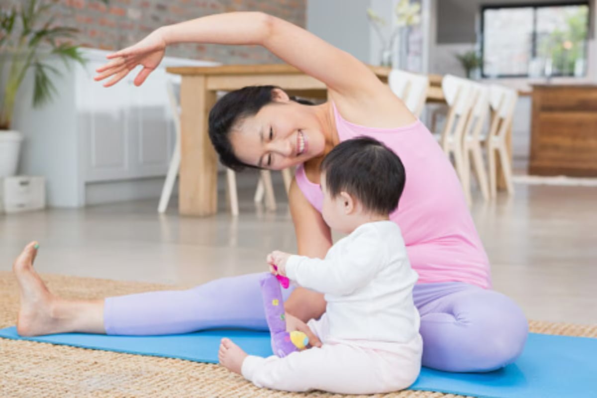 Mother exercising with baby in park