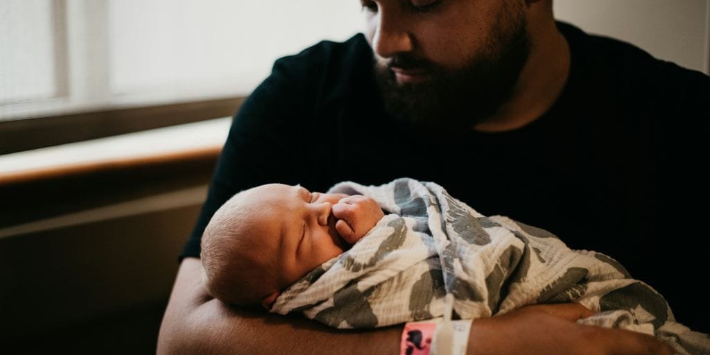 a man holding a baby